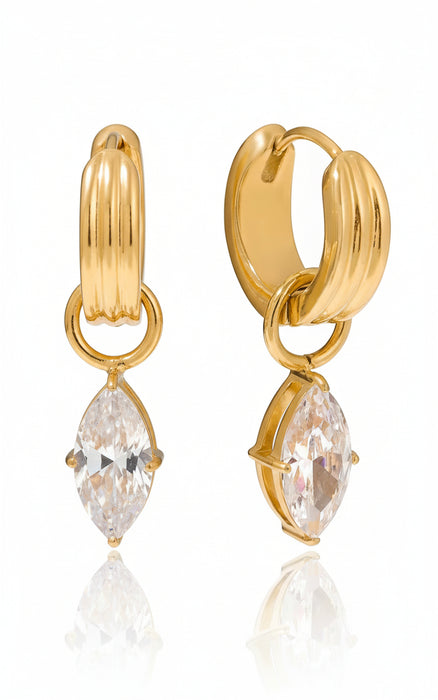 Gold hoop earring with a clear gemstone on a white background